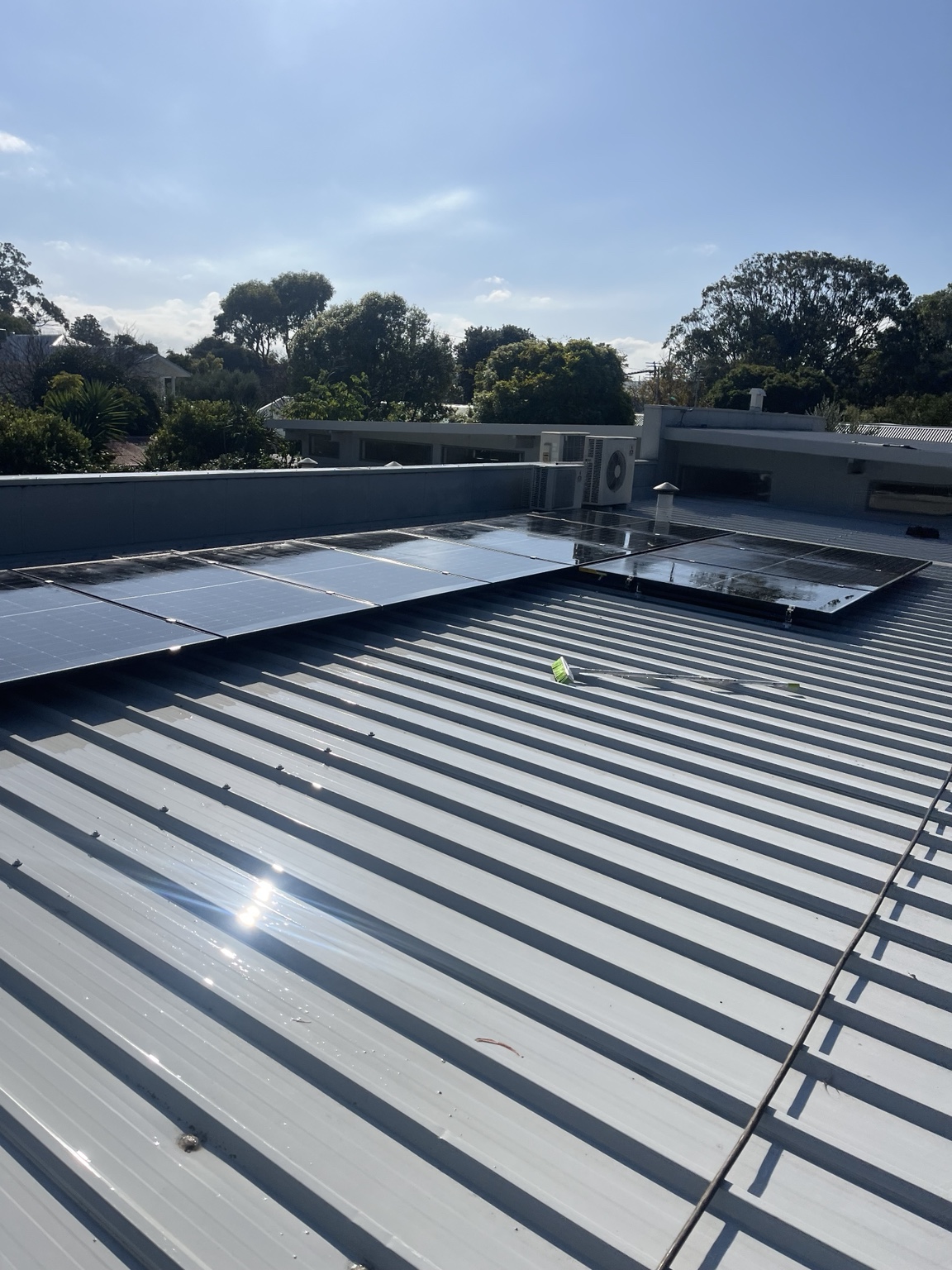 Solar panels cleaned on a commercial metal roof